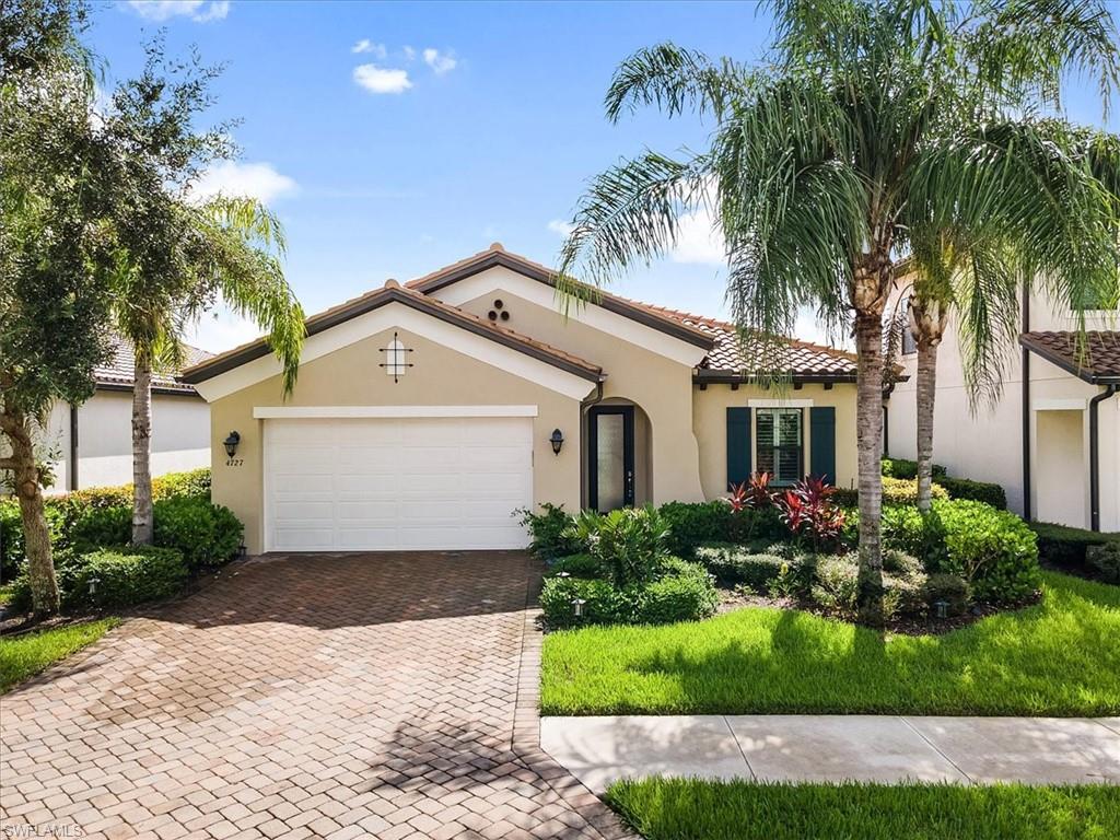 Mediterranean / spanish-style home featuring a garage