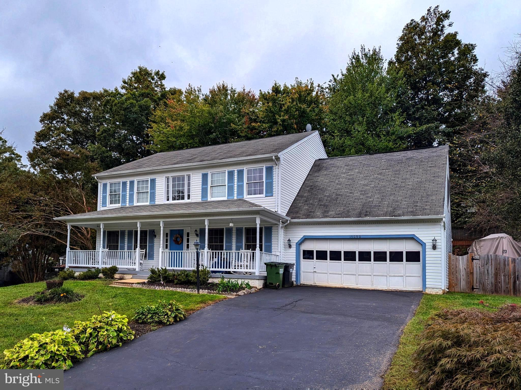 a view of a house with a garden and yard