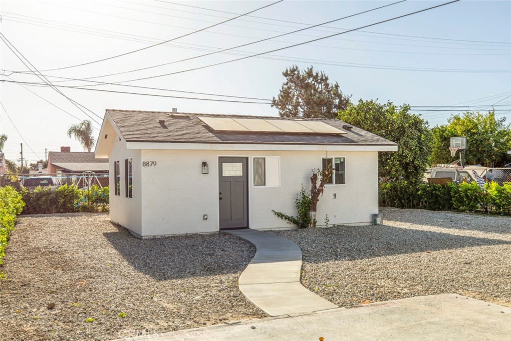 a front view of a house with garden