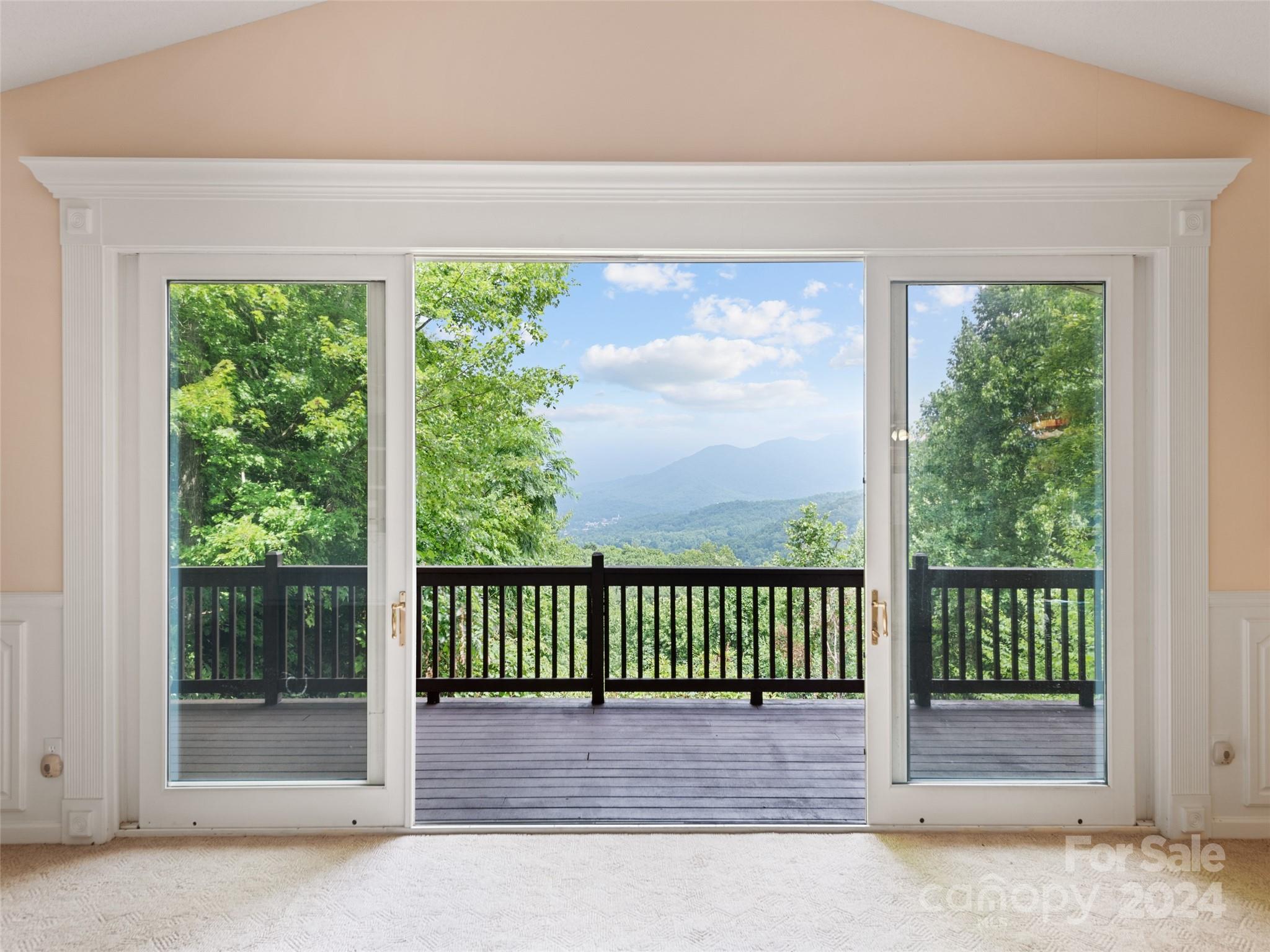 a view of a porch with a floor to ceiling window