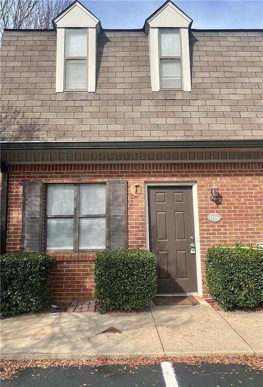 a front view of a house with garage