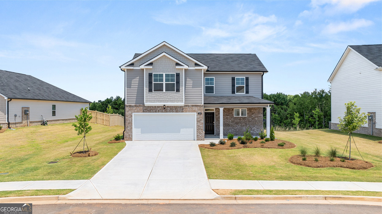 a front view of house with yard outdoor seating and barbeque oven