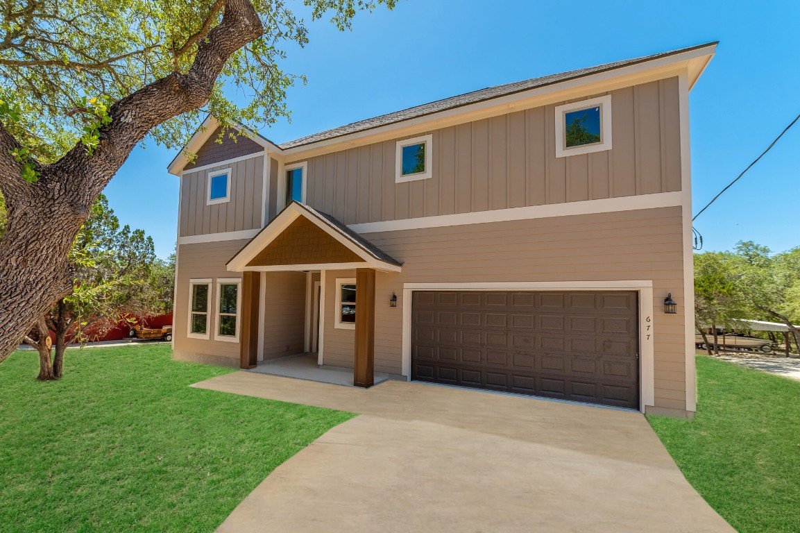 a view of a house with a yard