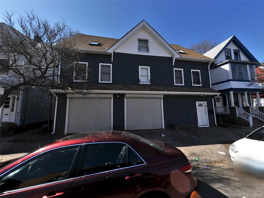 a view of house and car parked