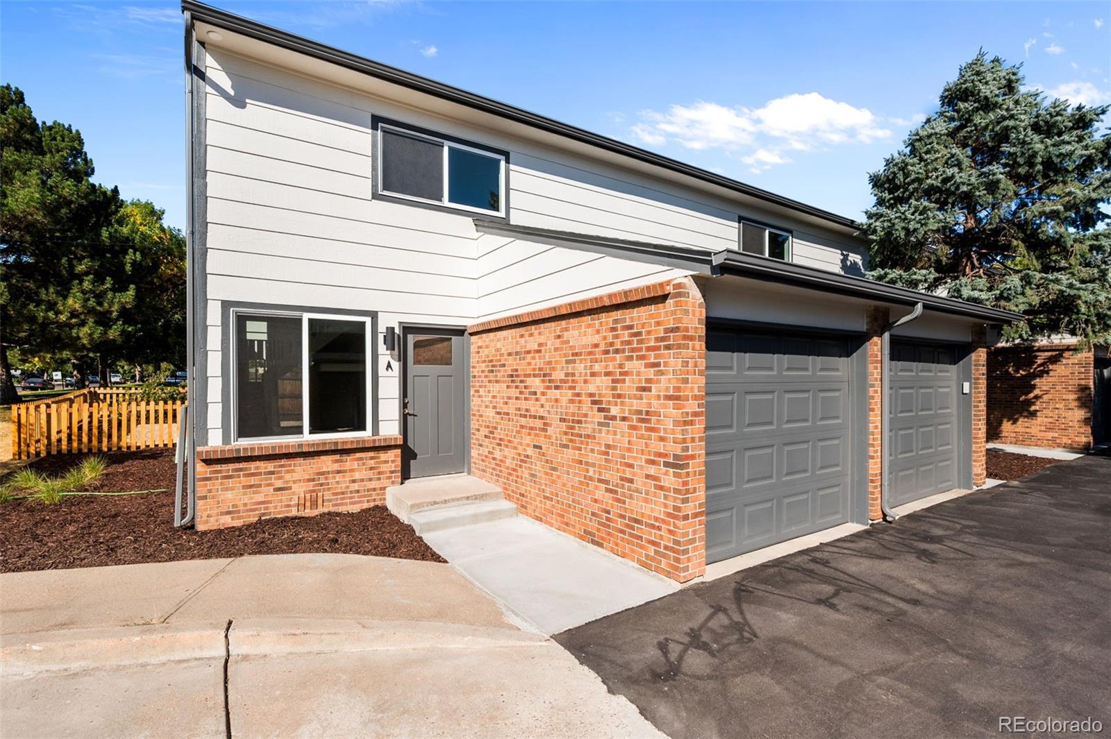 a front view of a house with a garage