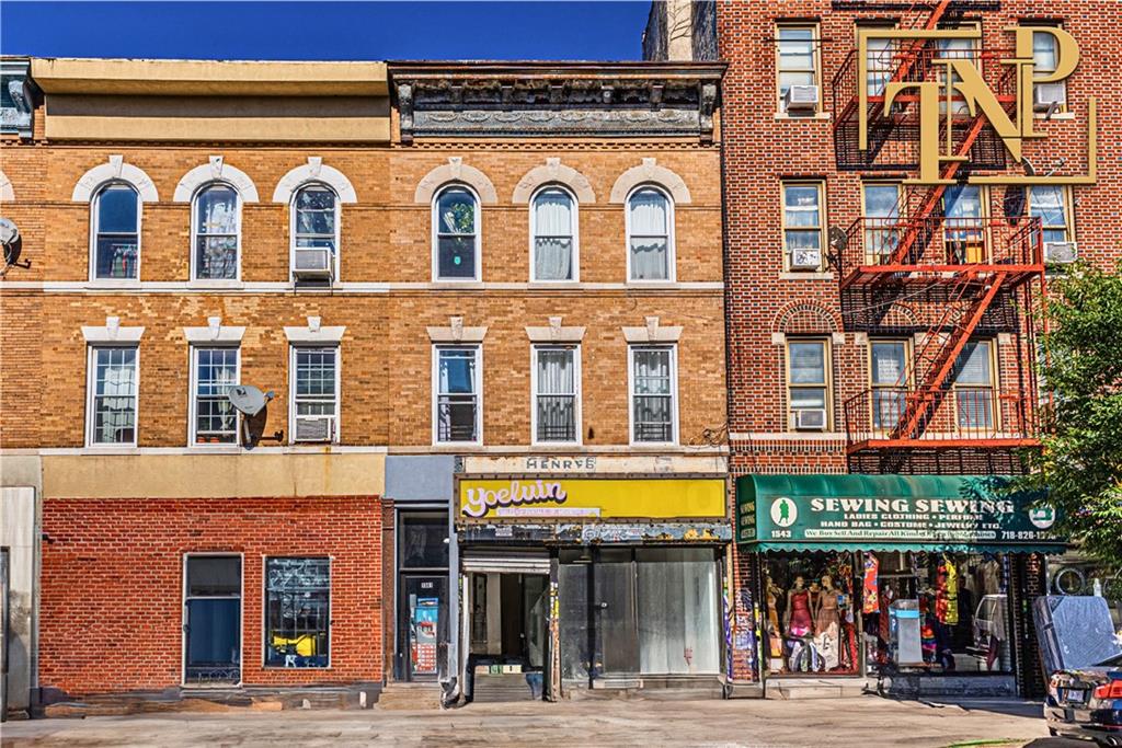 a view of a building with a street