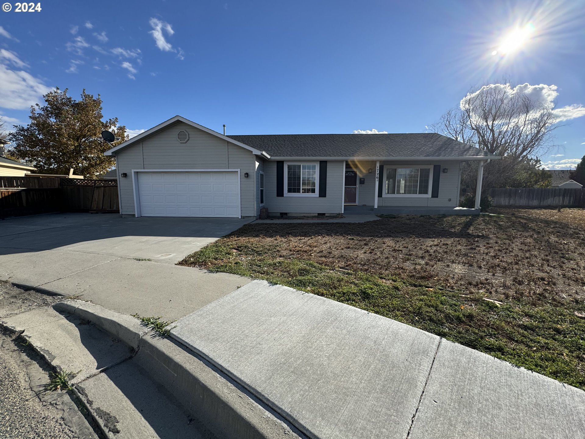 a front view of a house with yard