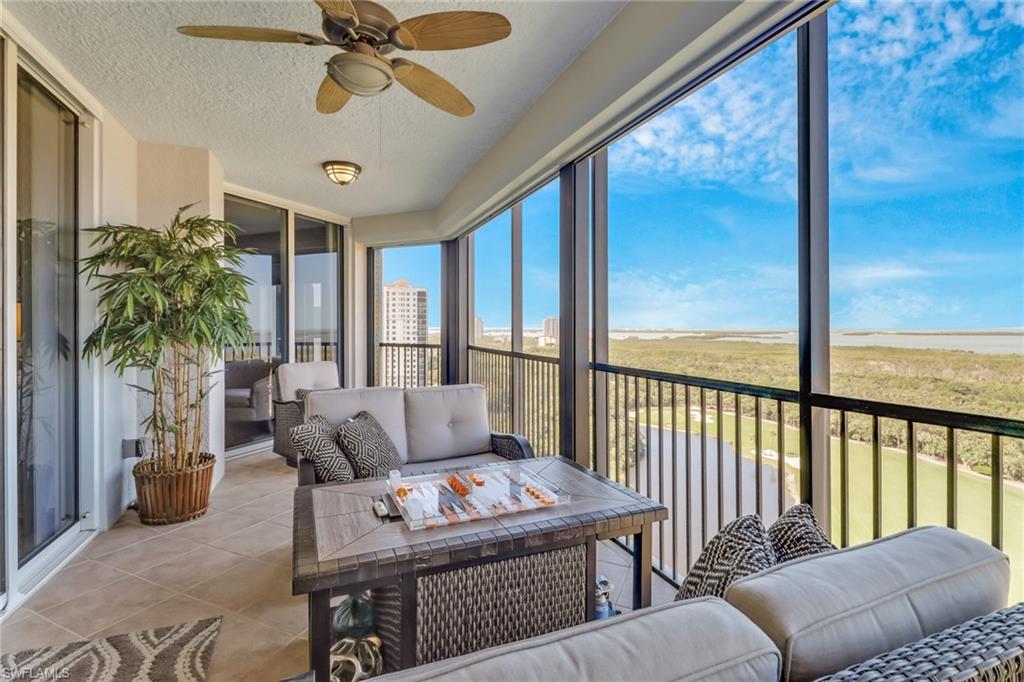 Sunroom / solarium featuring ceiling fan