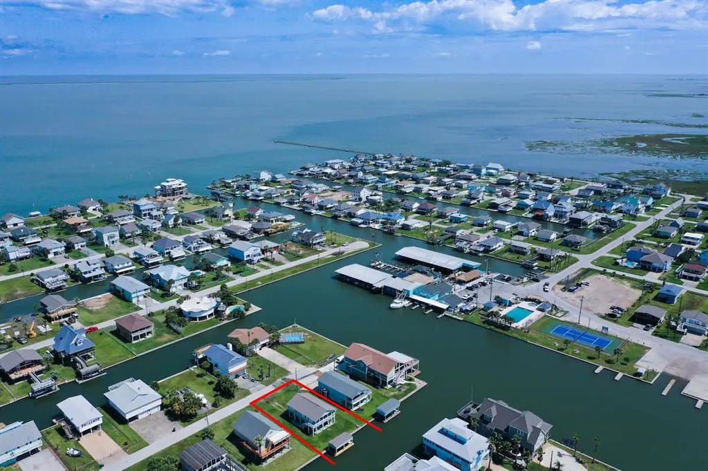 an aerial view of a city with ocean view