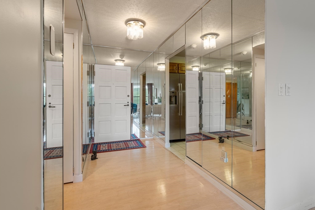 a bathroom with a mirror and a shower