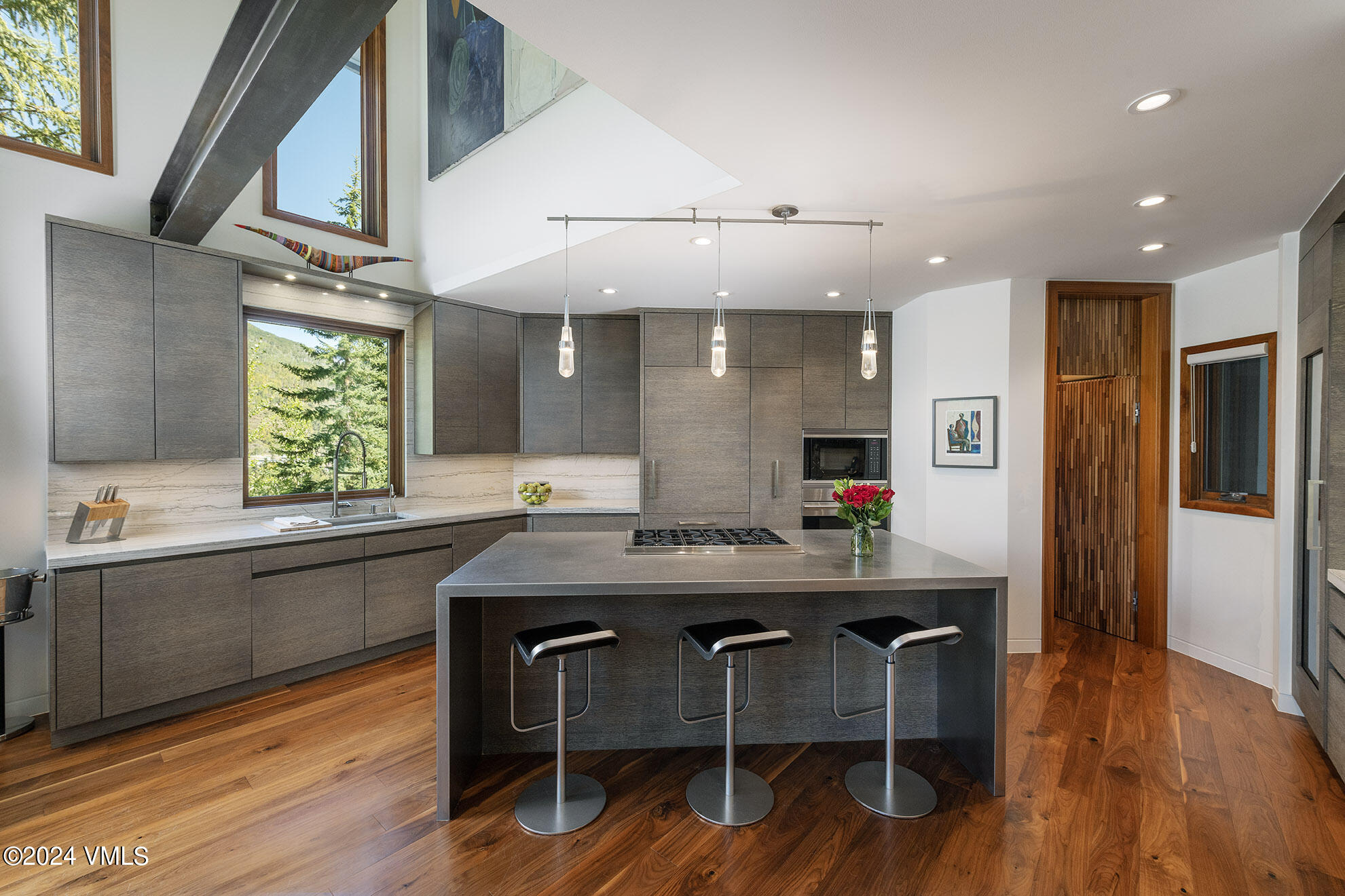 a kitchen with a table and chairs in it