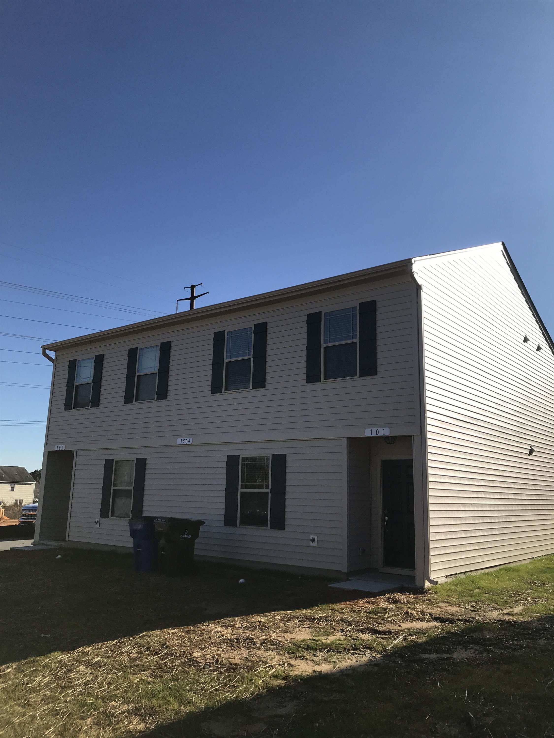 a front view of house with yard