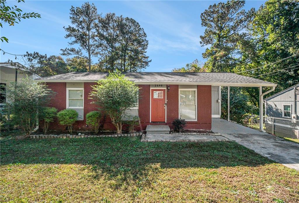 front view of a house with a yard