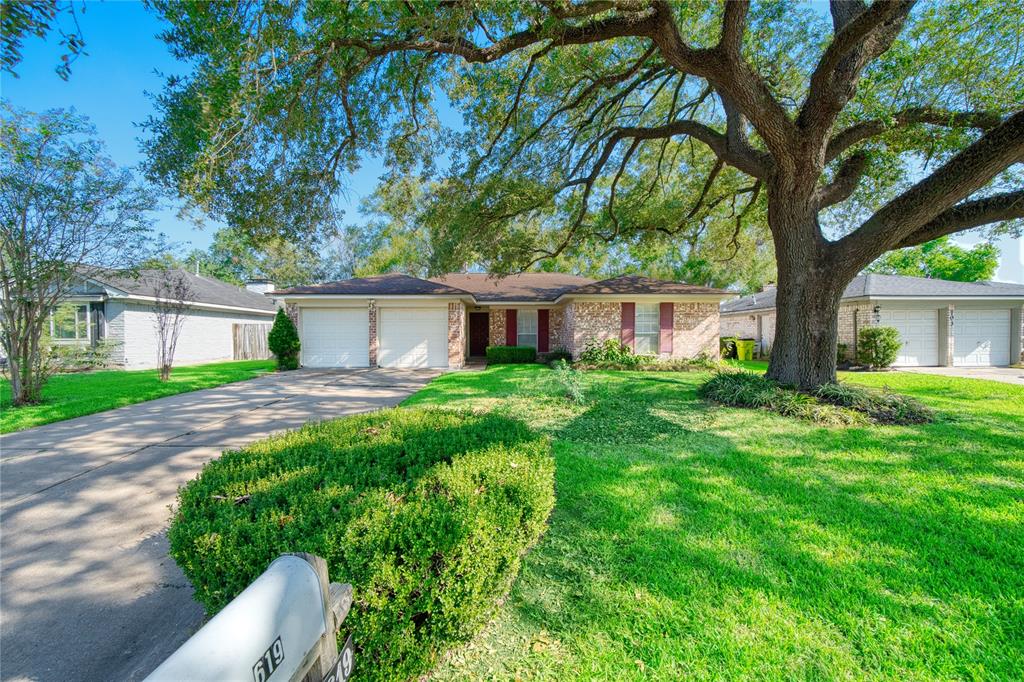 front view of a house and a yard