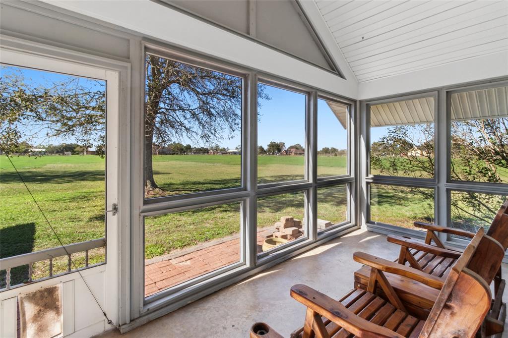 a living room with large windows