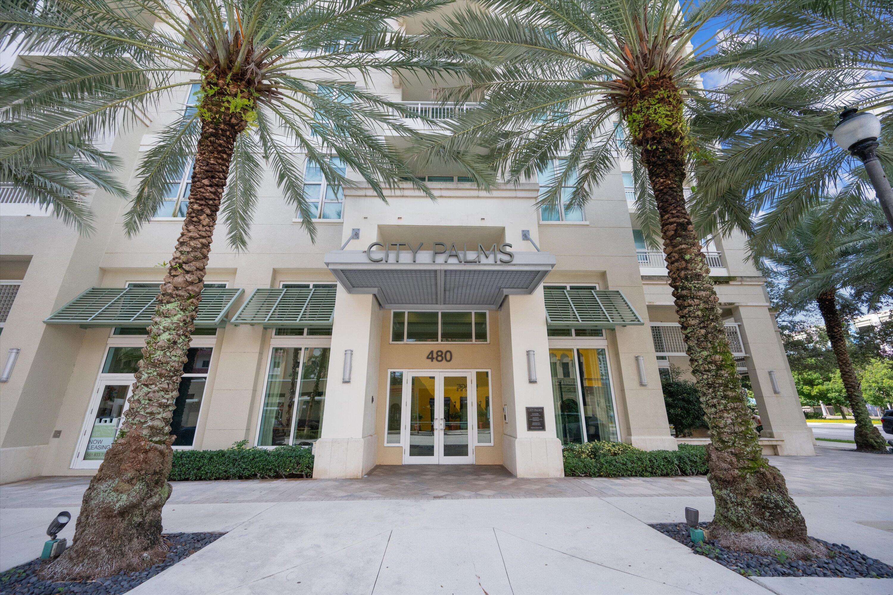 a front view of a building with garden