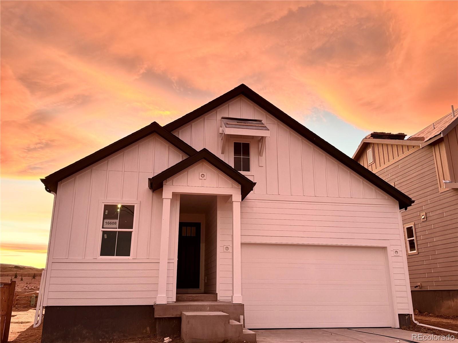 a front view of a house with garage