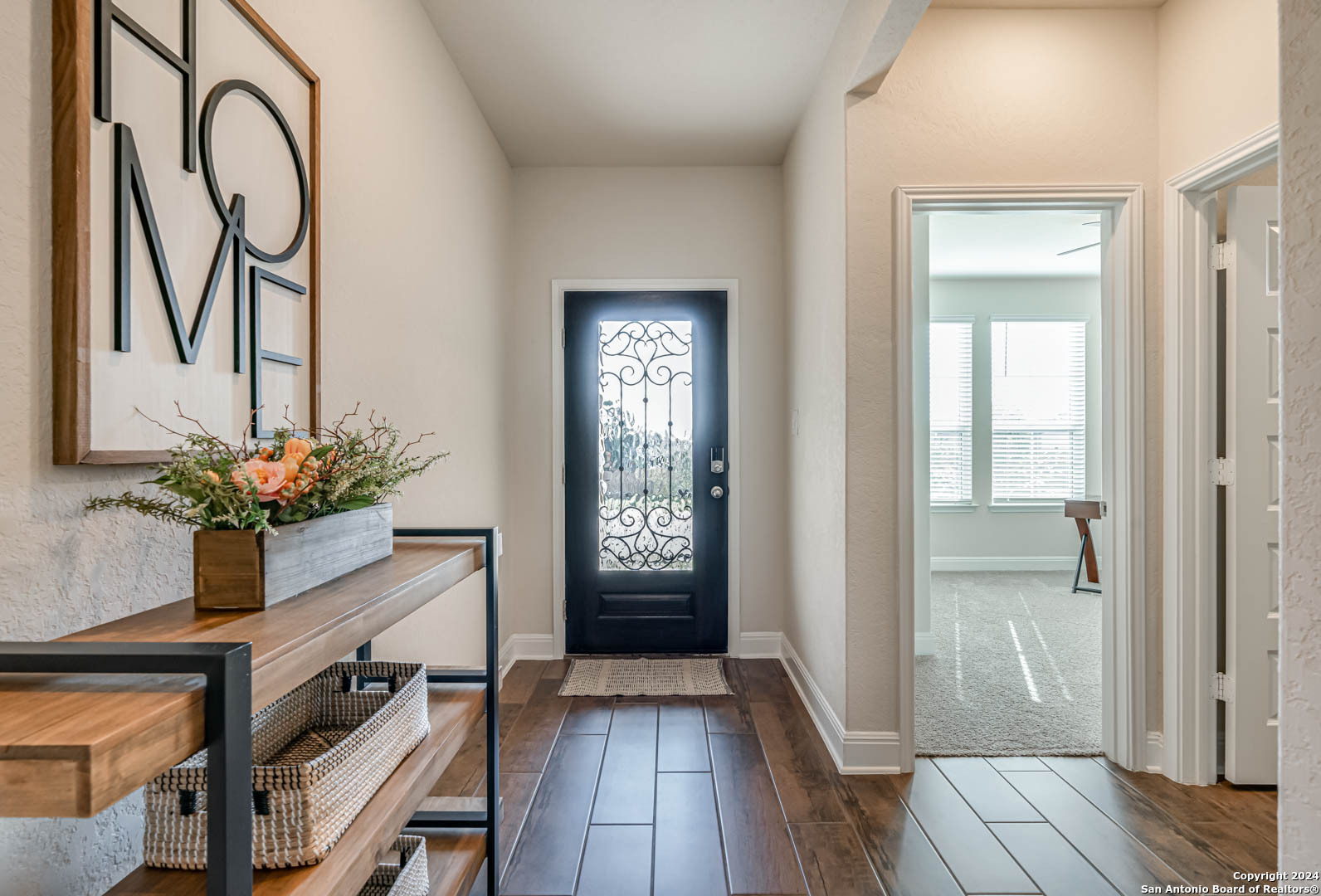 a view of an entryway with wooden floor