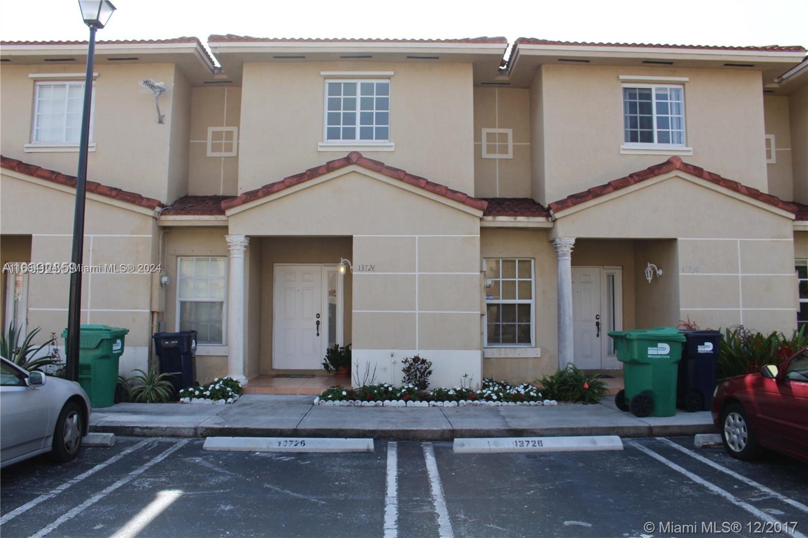 a front view of a house with yard