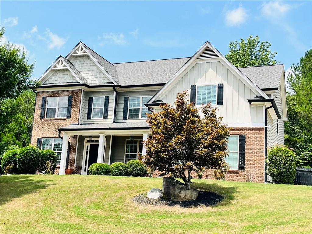 a front view of a house with a yard