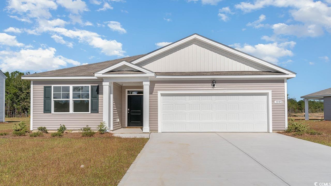 View of front of property featuring a front lawn a