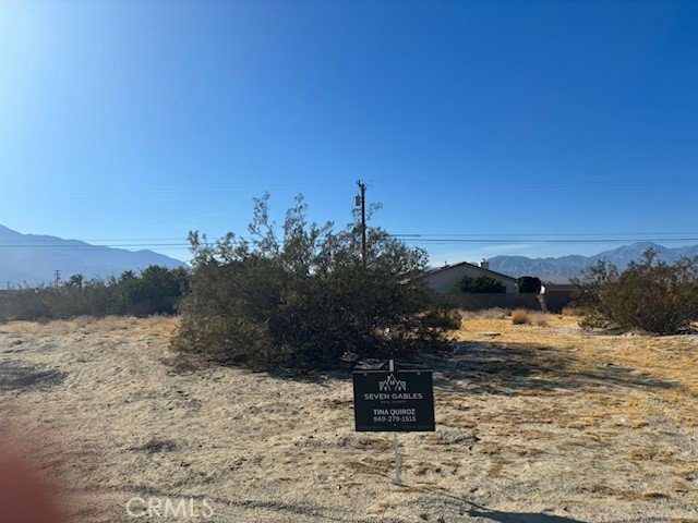 a view of a town with mountains in the background