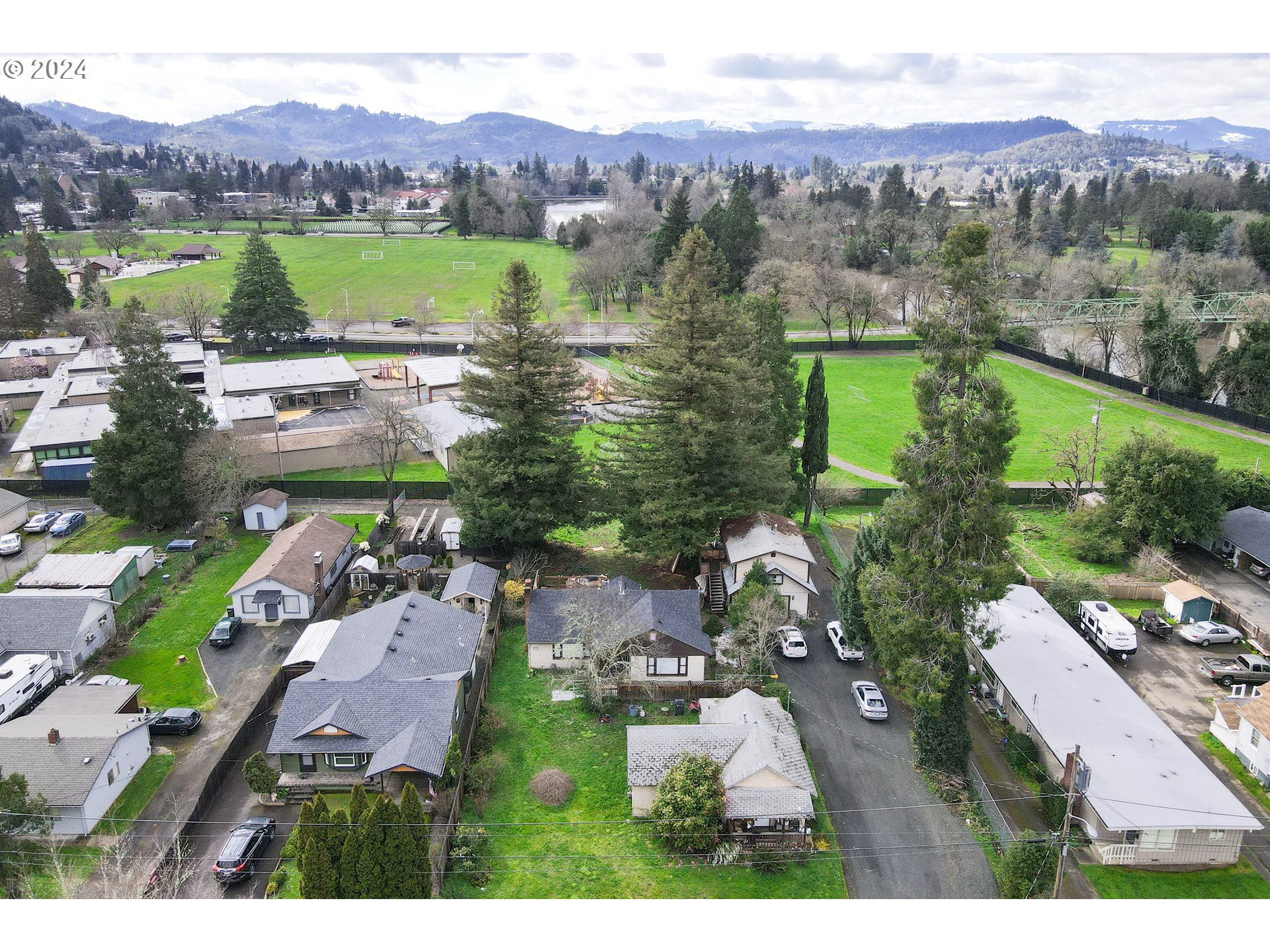 an aerial view of a town with couple of houses