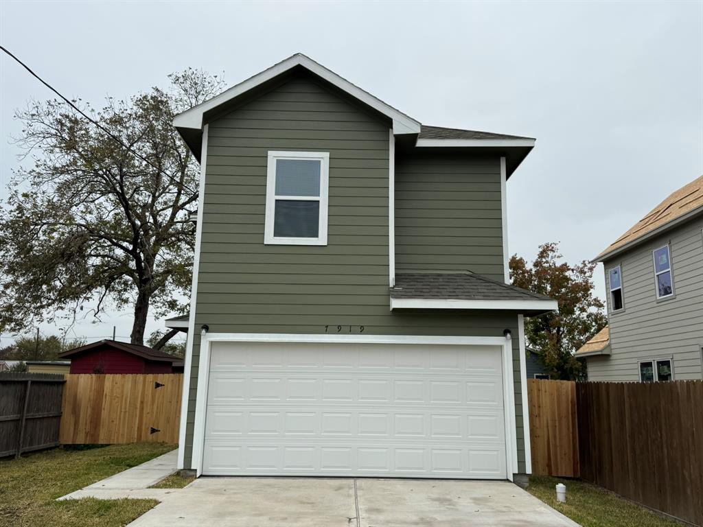 a side view of a house with garage