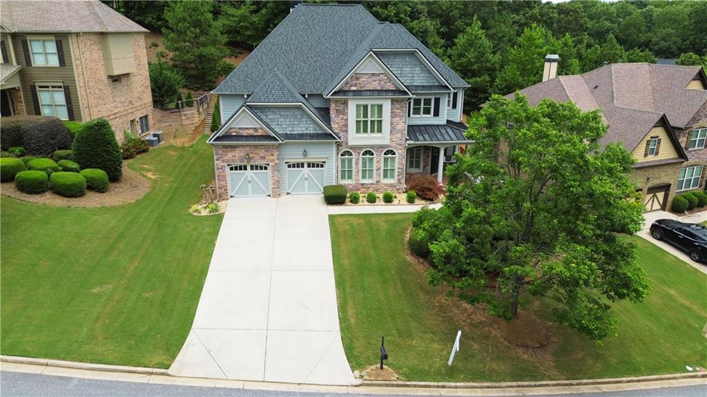 a aerial view of a house with a yard