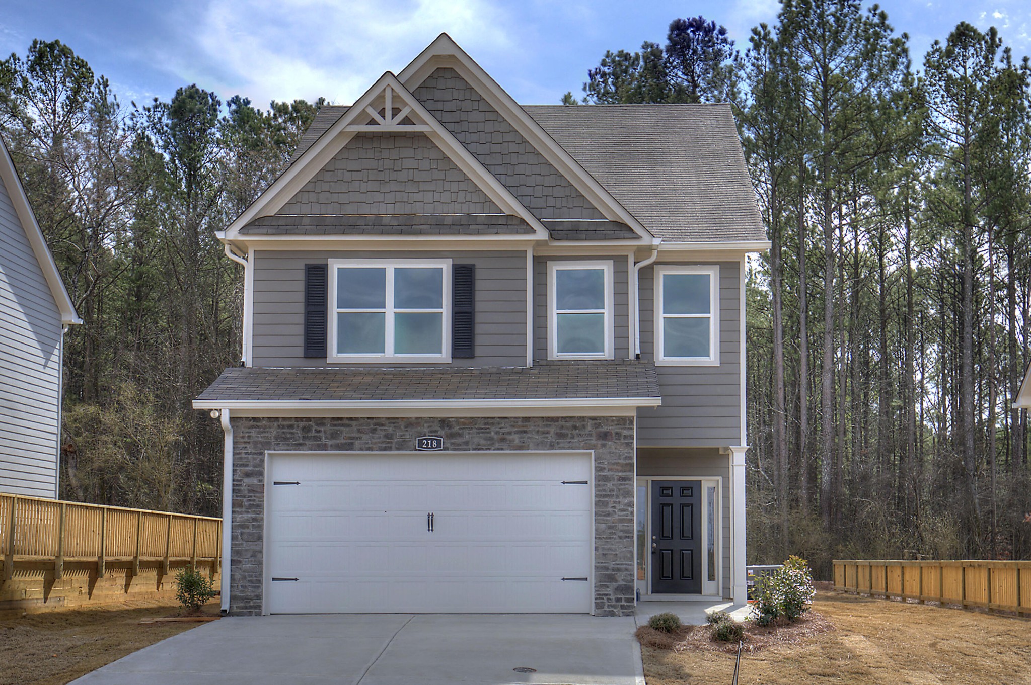 a front view of a house with a garage