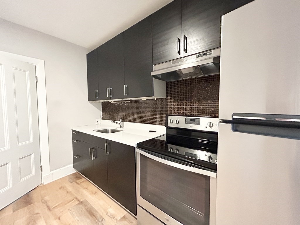 a kitchen with a stove and a microwave