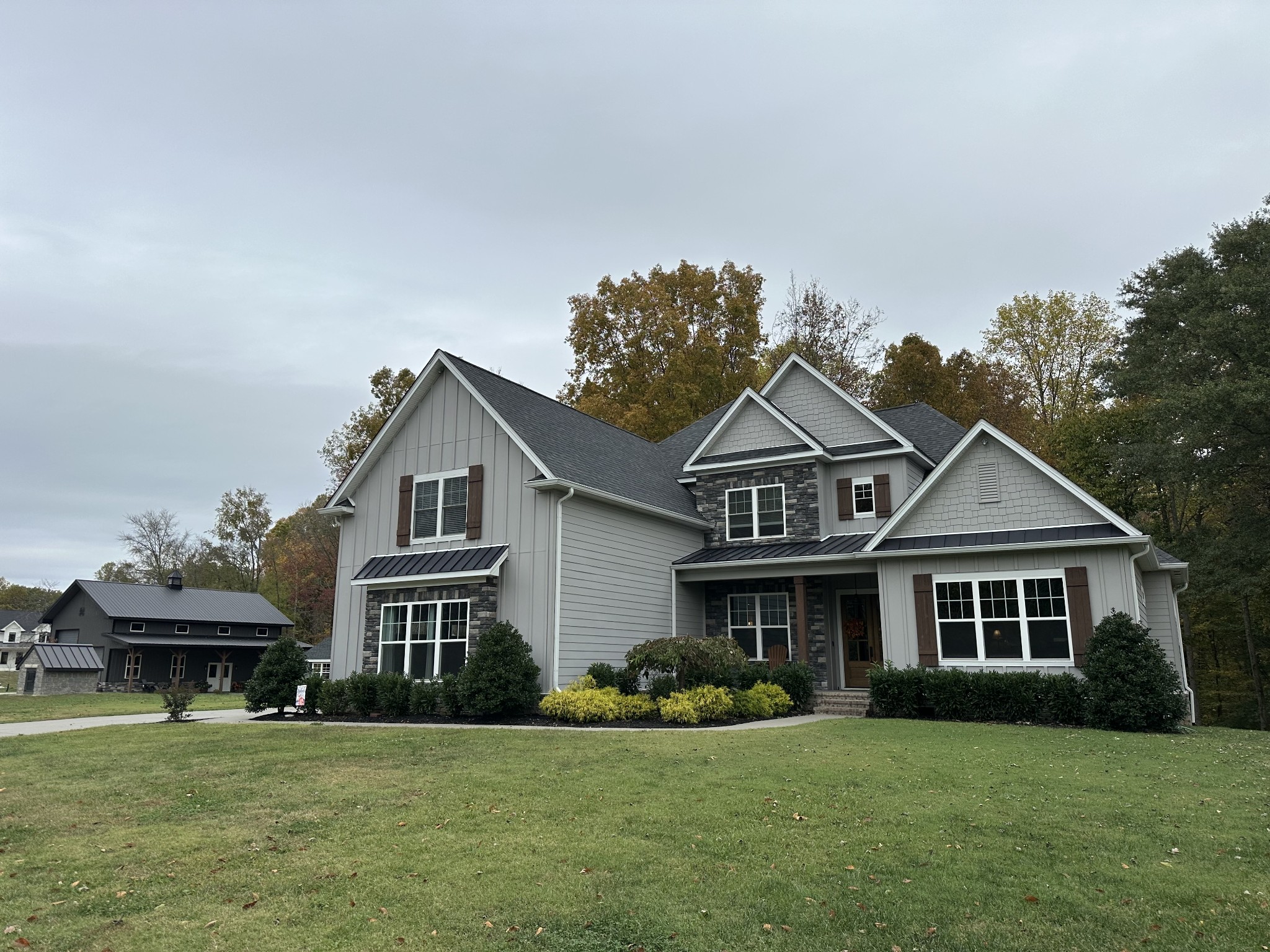 a front view of a house with a garden