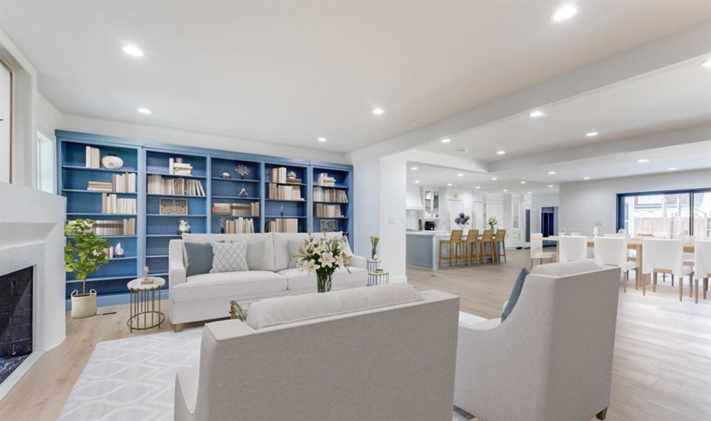 a living room with furniture and a book shelf