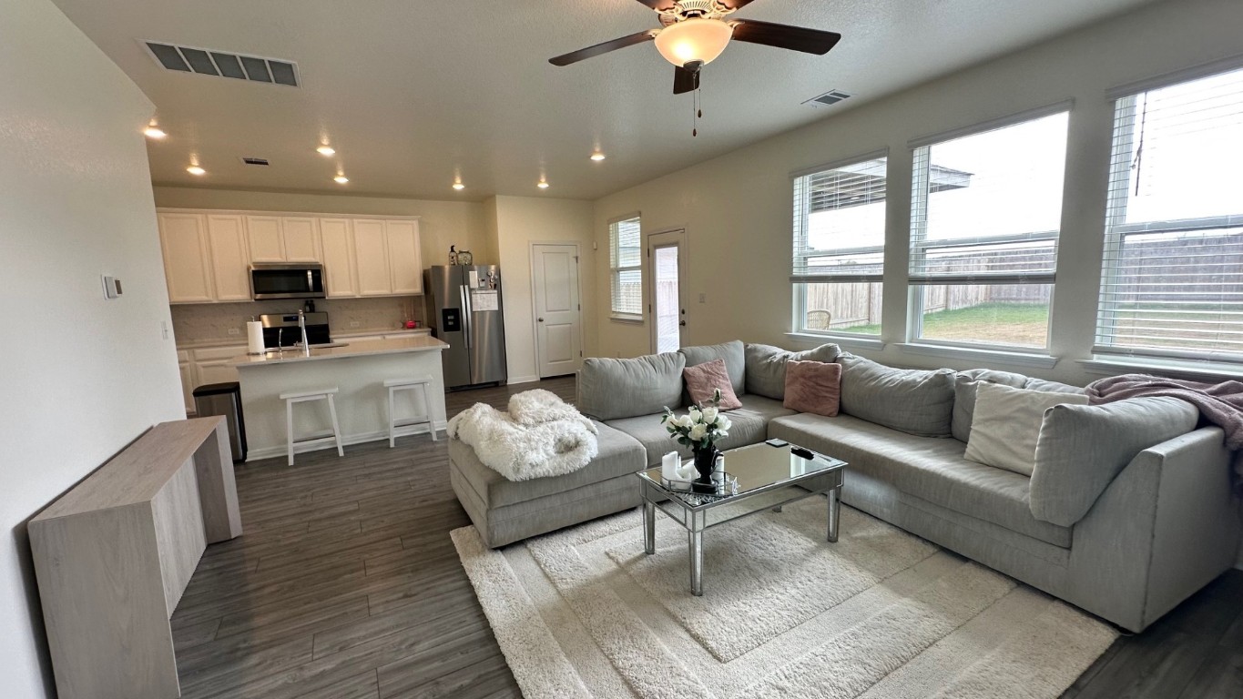 a living room with furniture and a large window