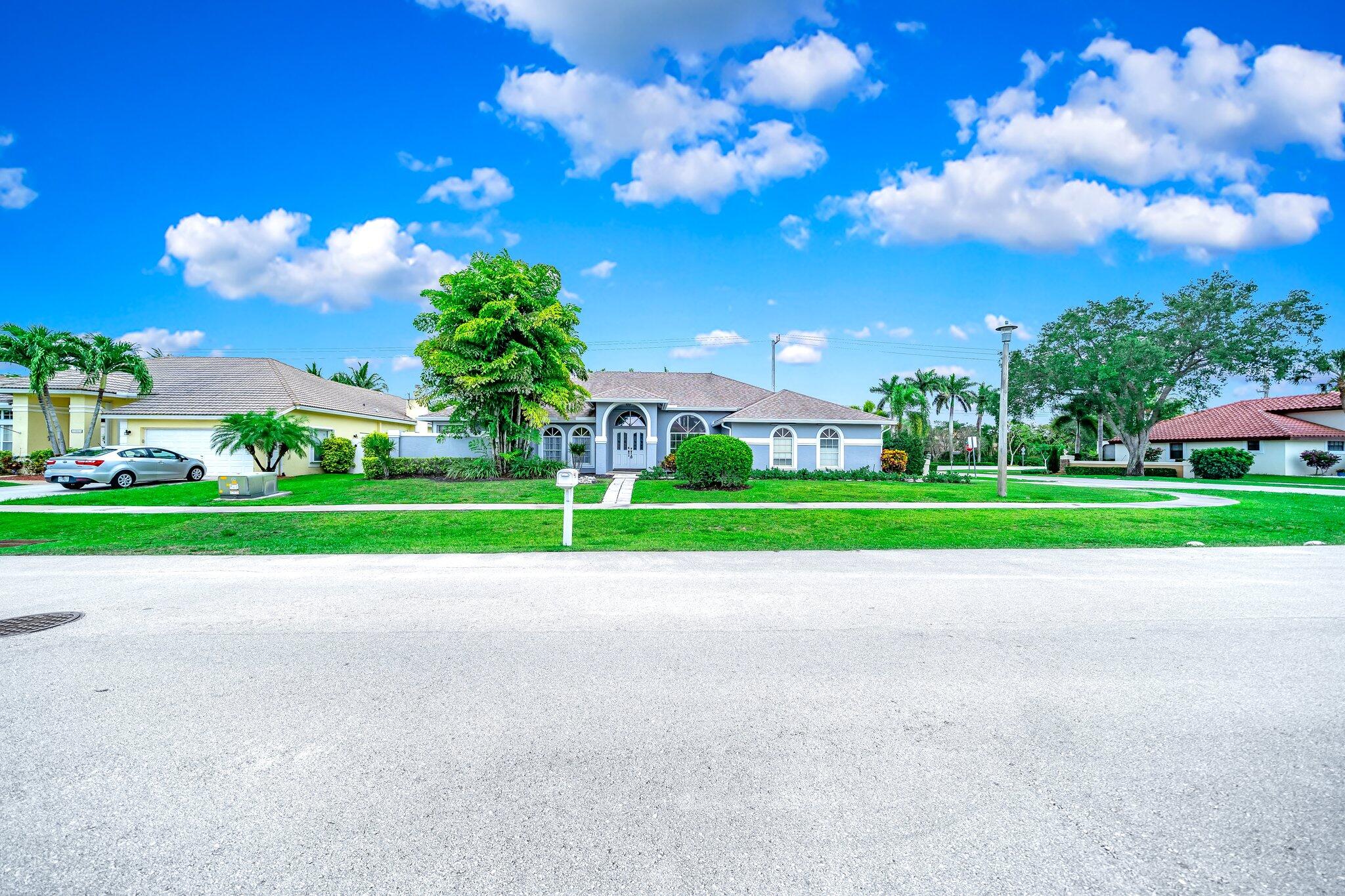 a view of a house with a big yard