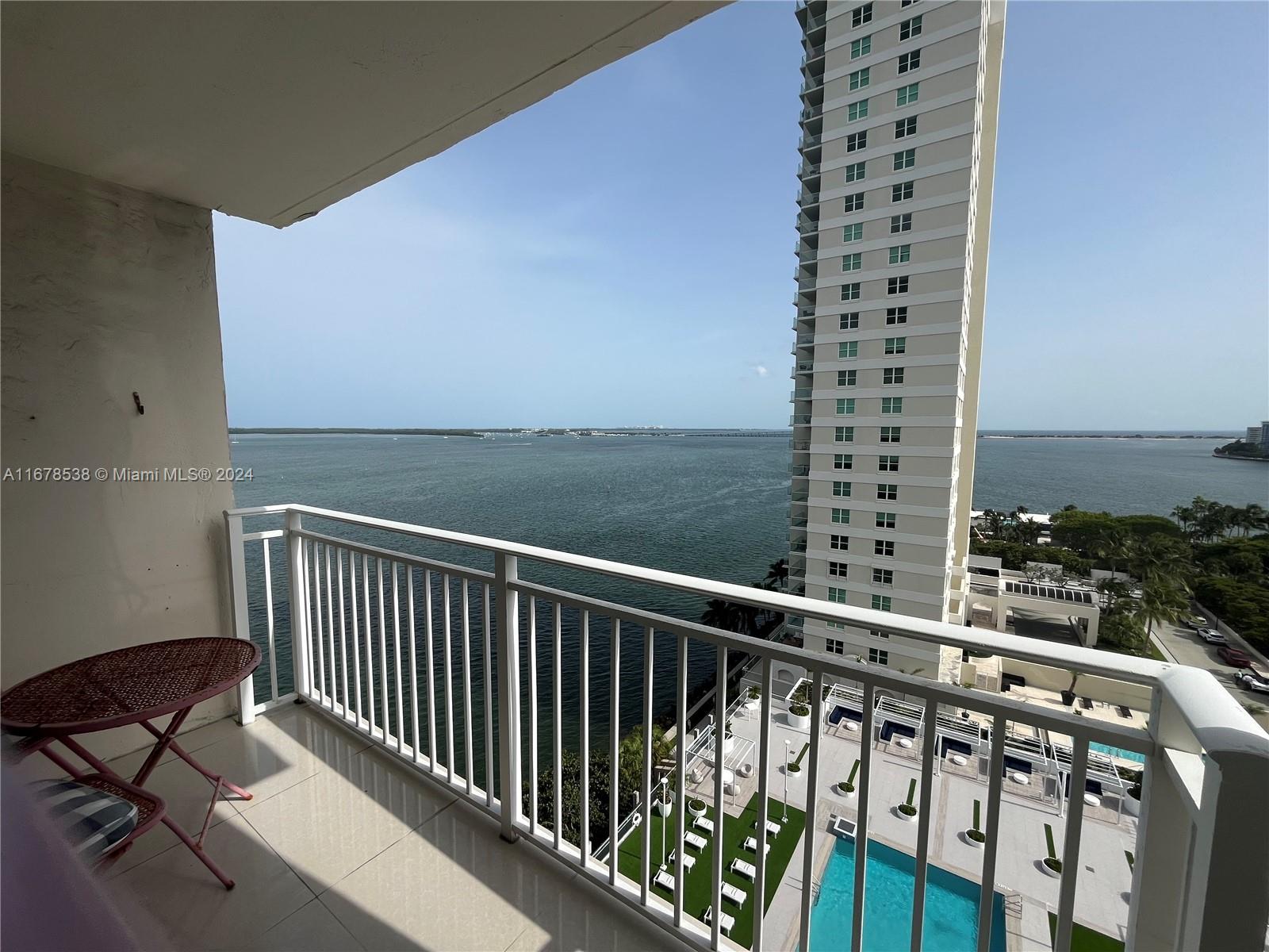 a view of balcony with furniture