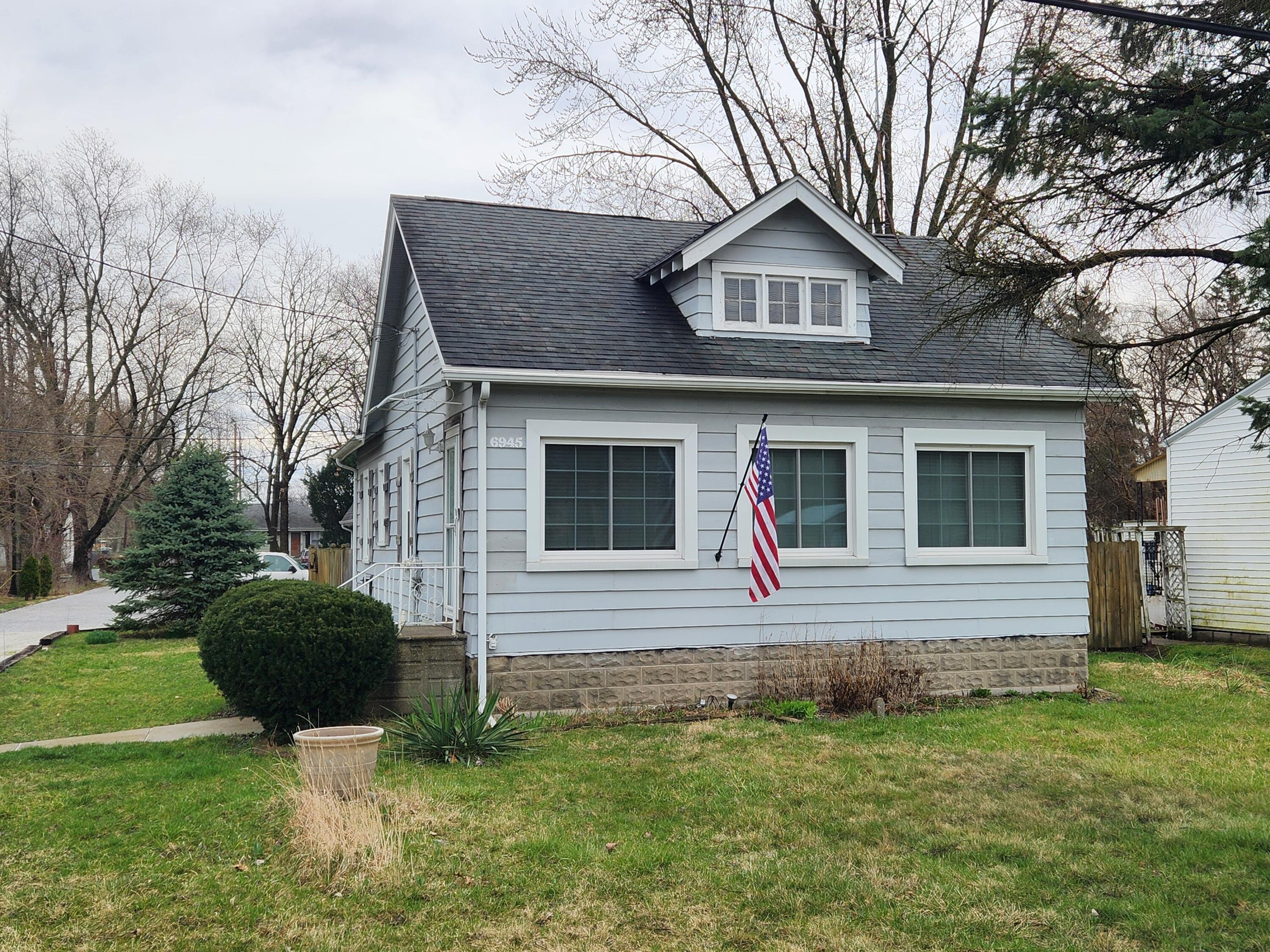 a front view of a house with yard