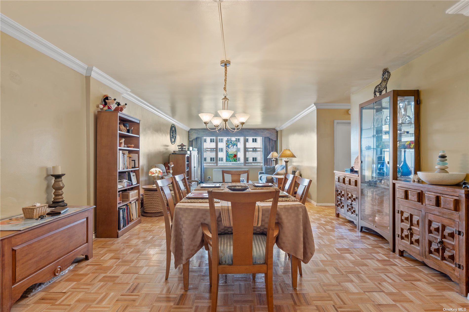 a view of a dining room with furniture and chandelier