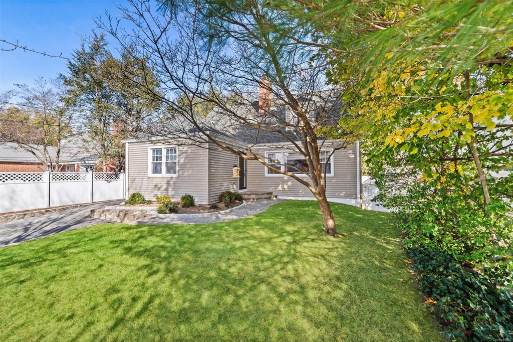 front view of a house with a yard