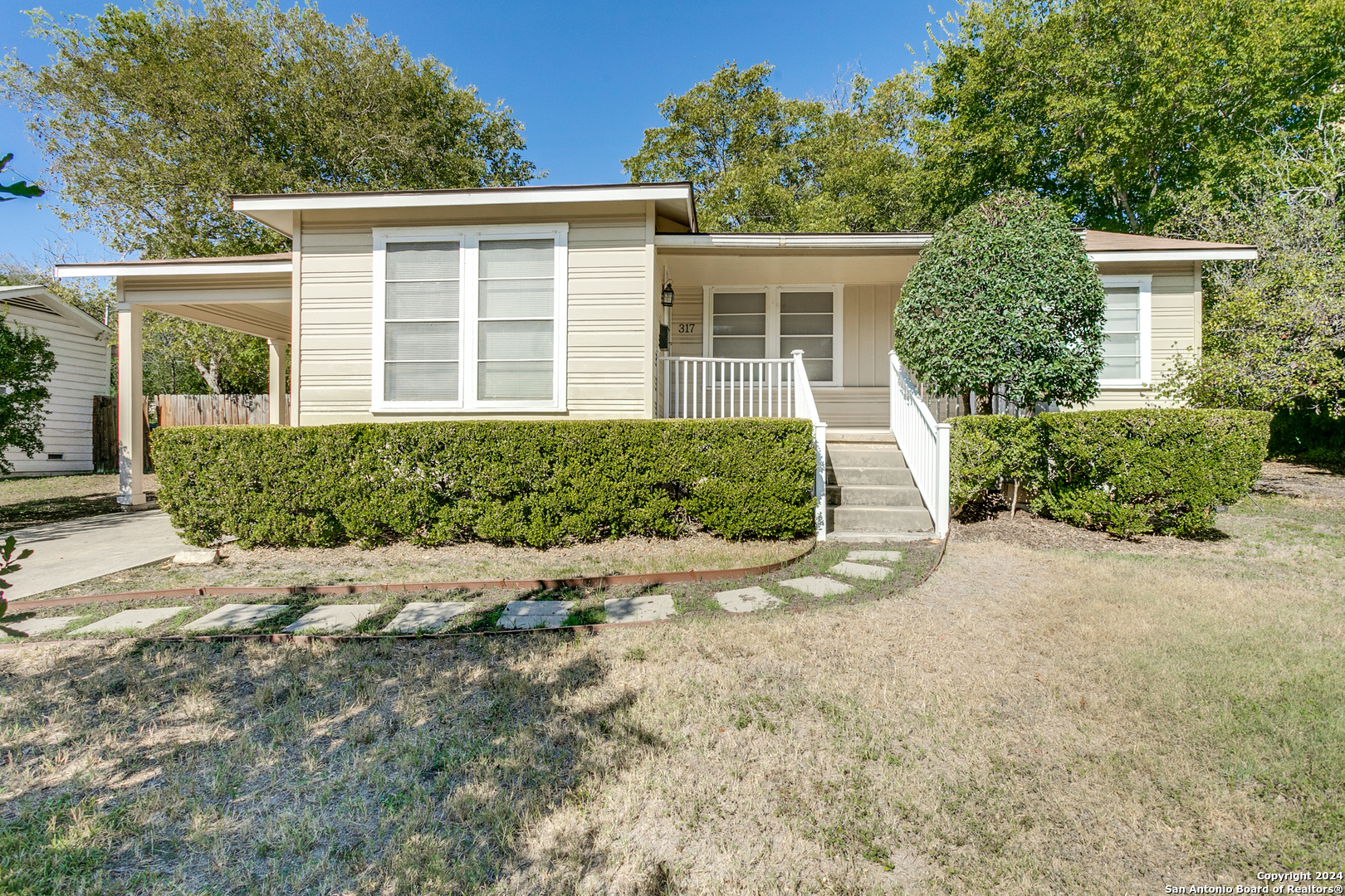 front view of a house with a yard