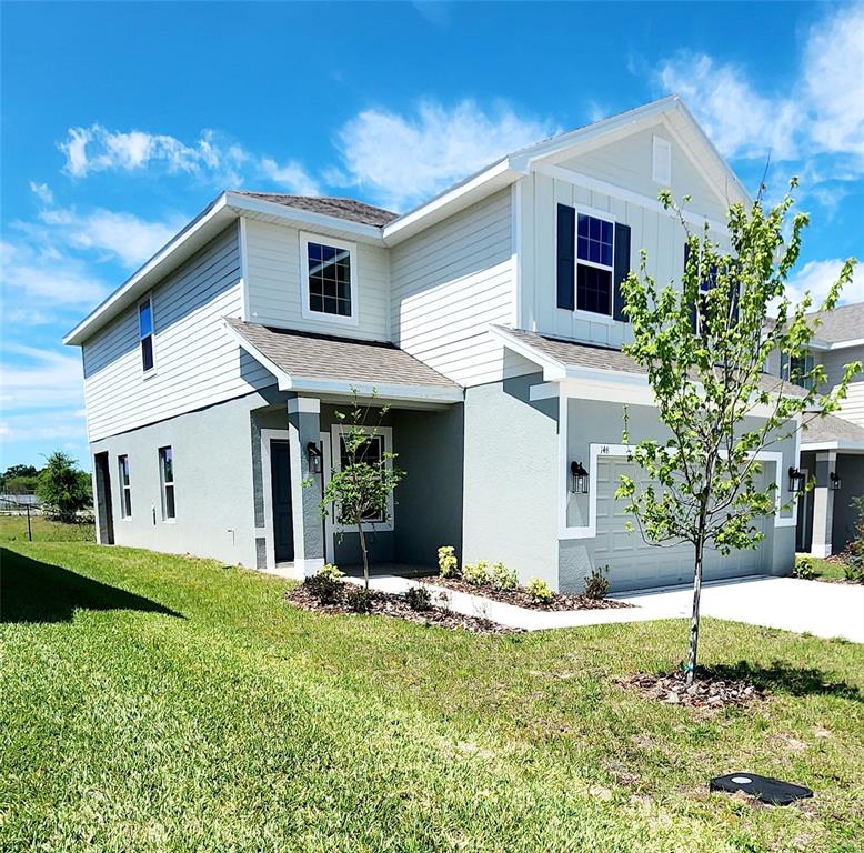 a front view of a house with a yard