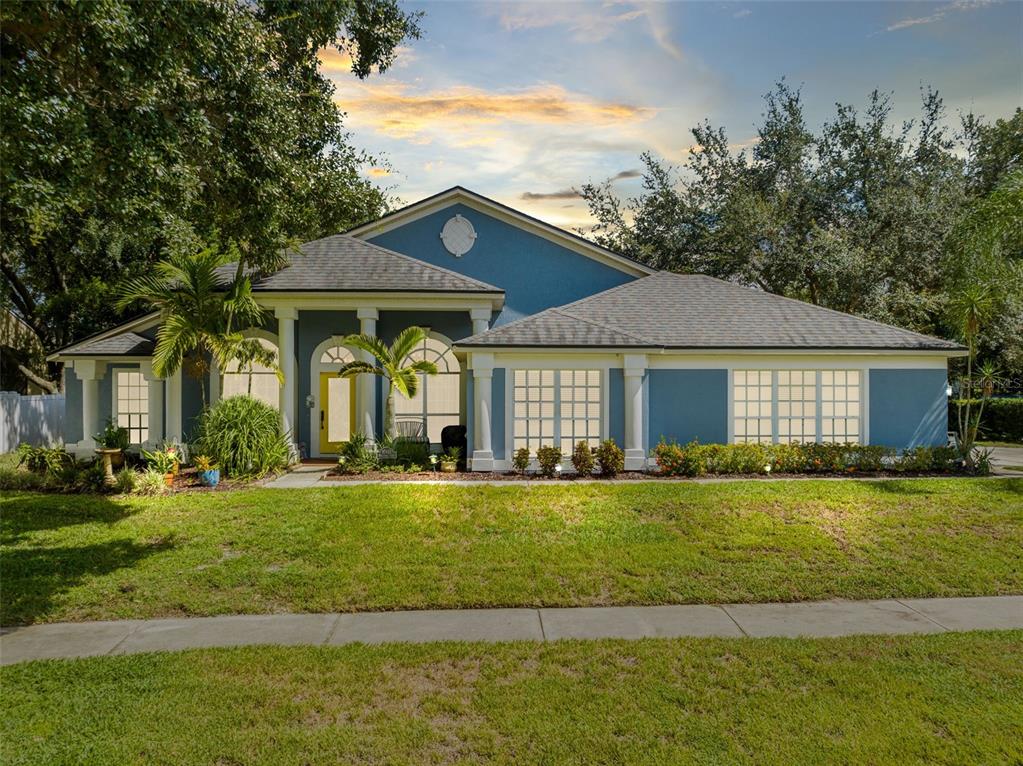 a front view of a house with a yard