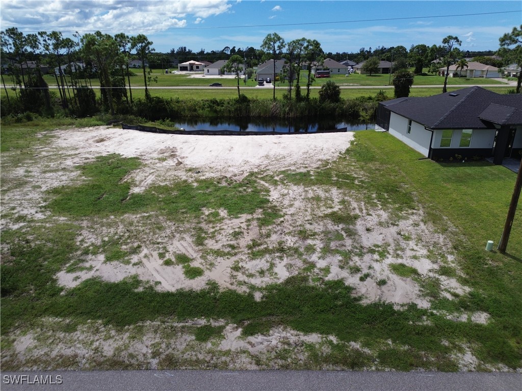 a view of a lake with a yard