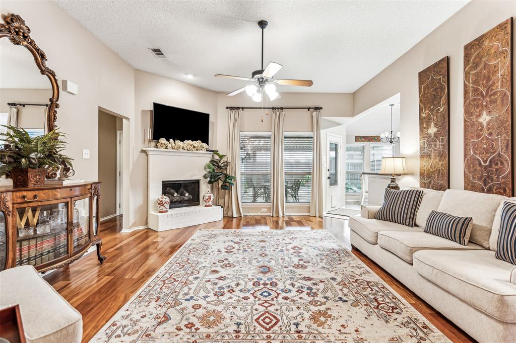 a living room with furniture fireplace and a flat screen tv