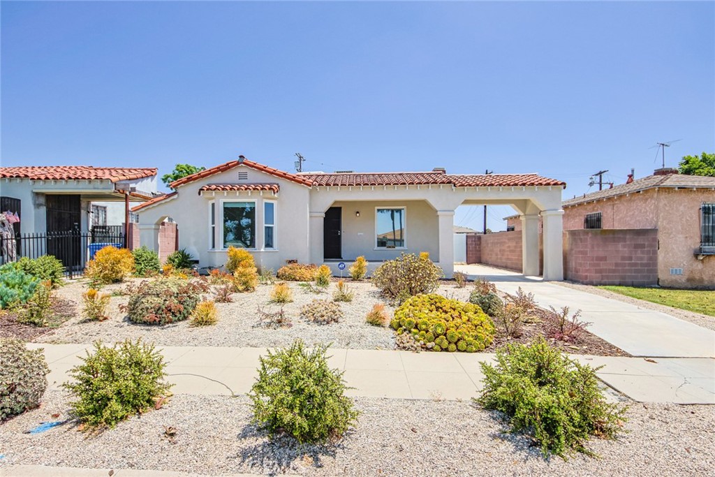 front view of a house with a bench