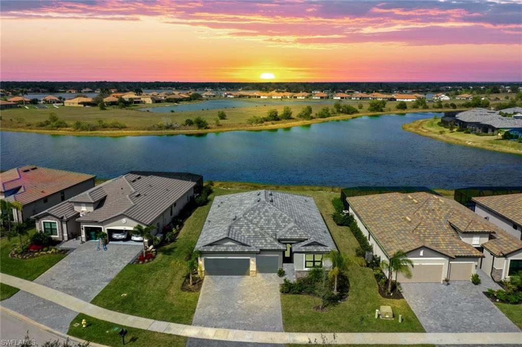 an aerial view of a house with a lake view