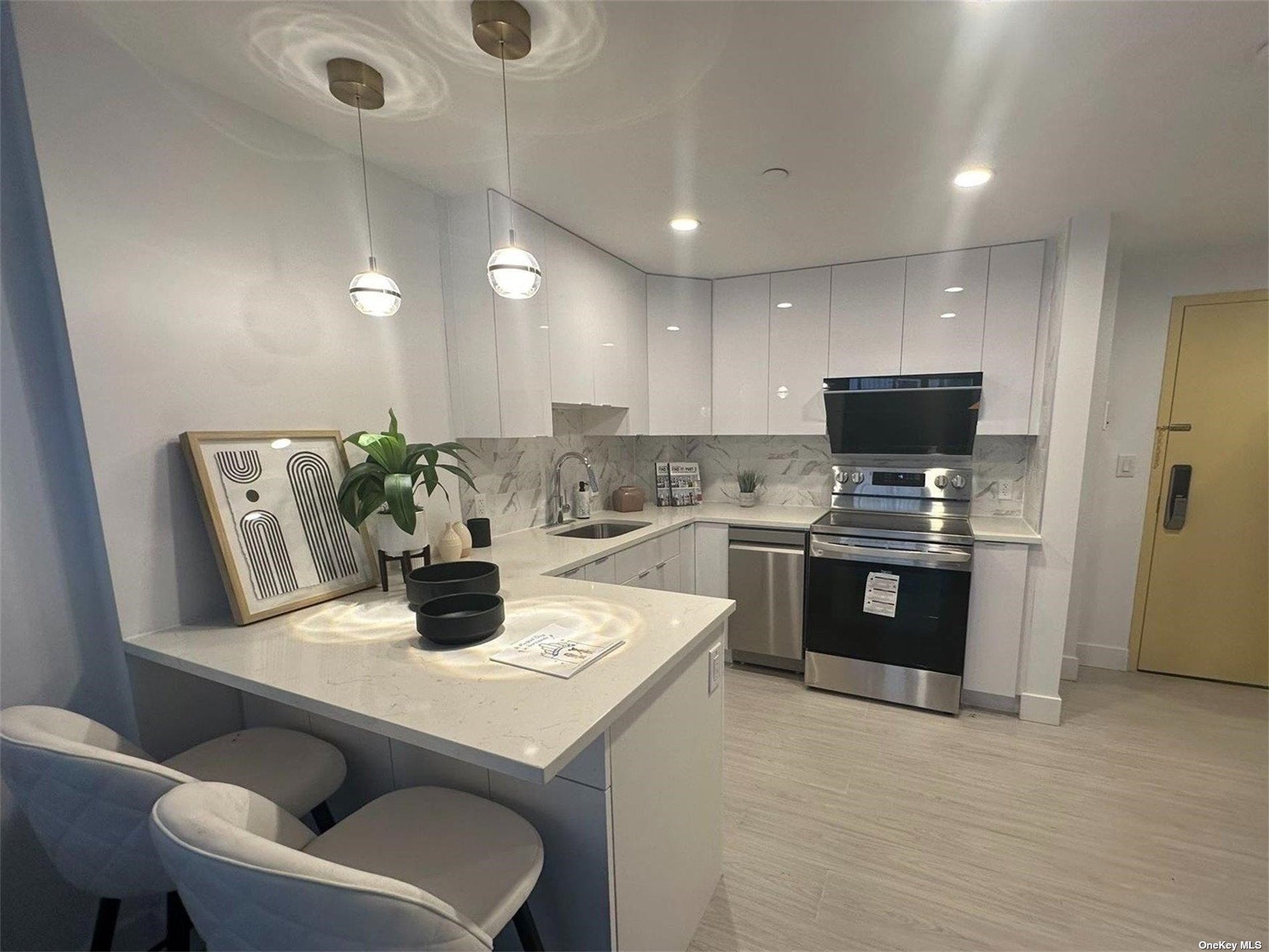 a kitchen with a stove a refrigerator and a dining table