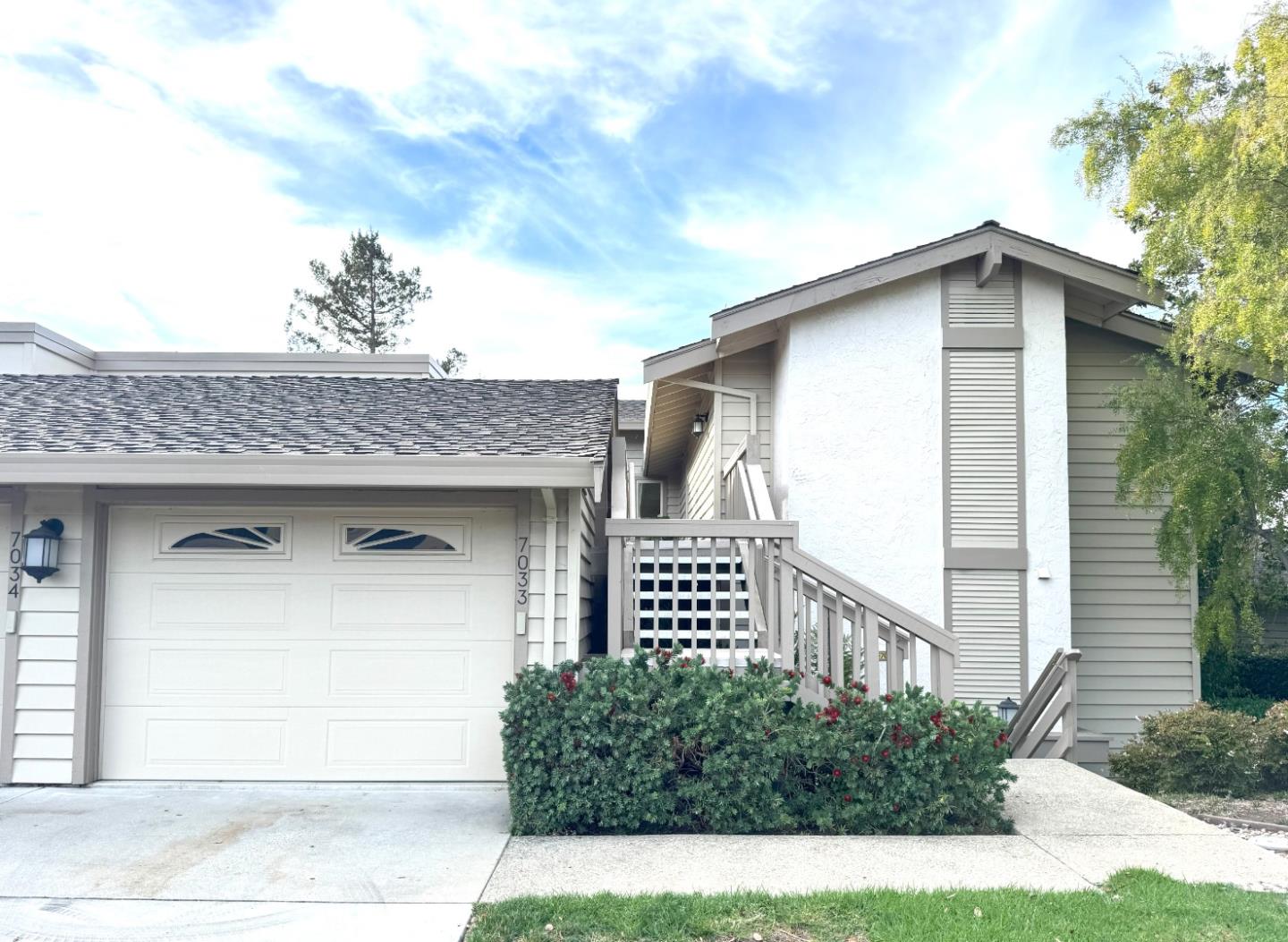 a front view of a house with a garage