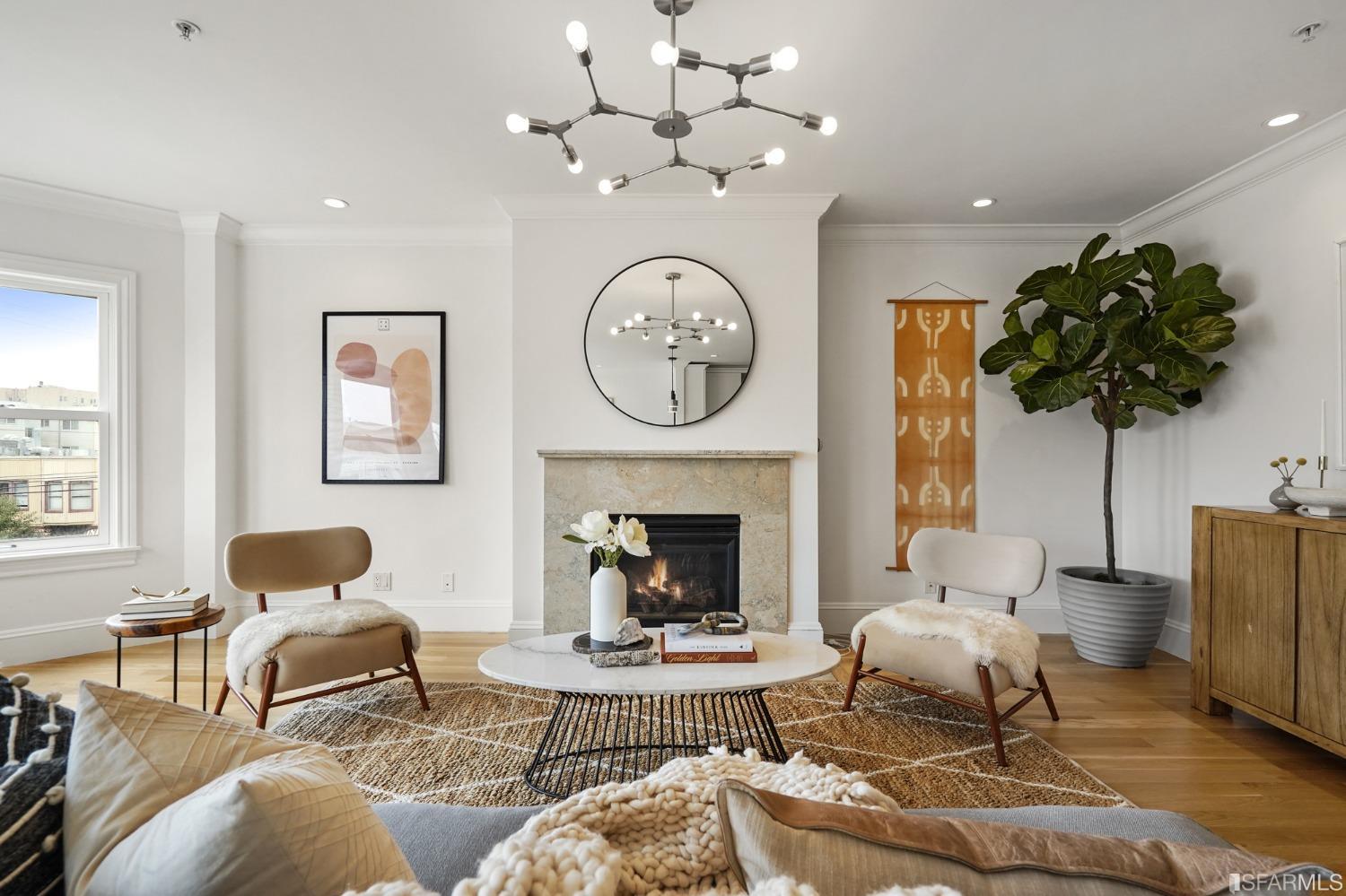 a living room with furniture a window and a fireplace