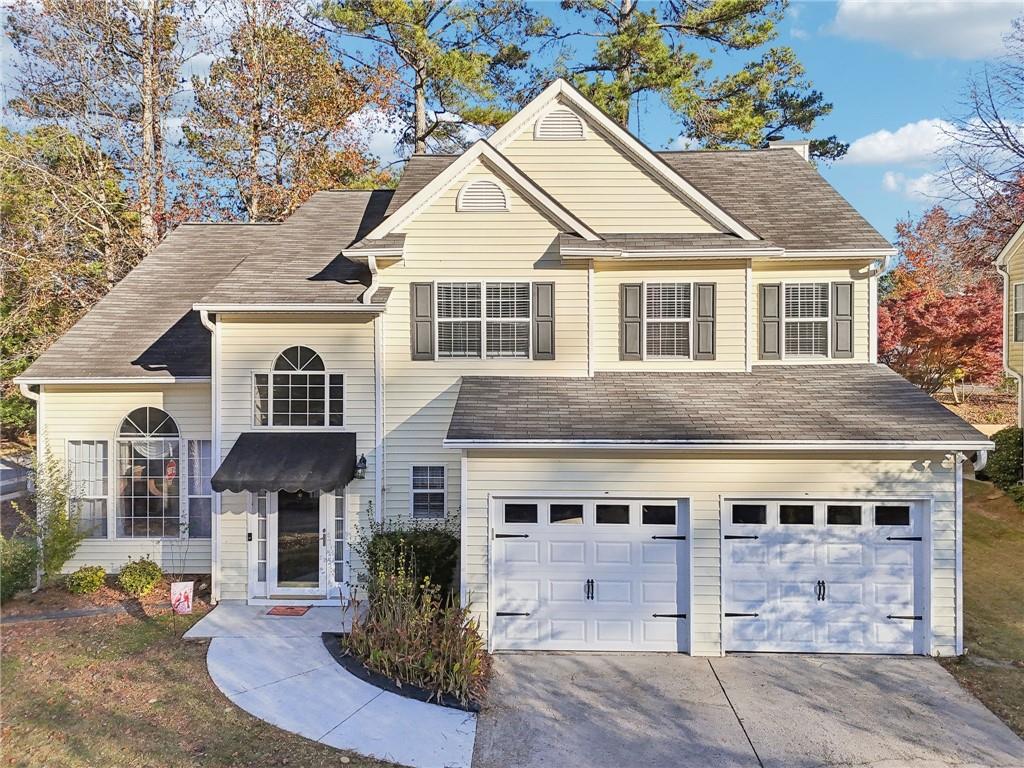 a front view of a house with a yard